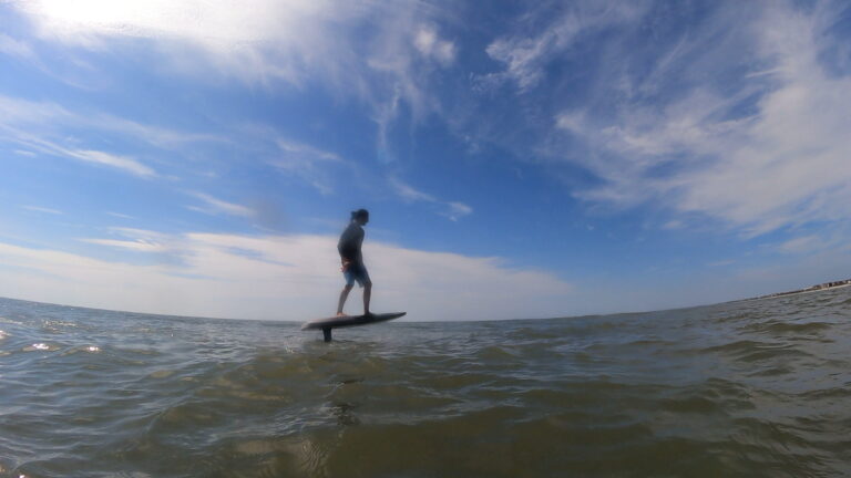 student riding an efoil in pawleys island near myrtle beach, south carolina